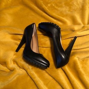 Black leather pumps